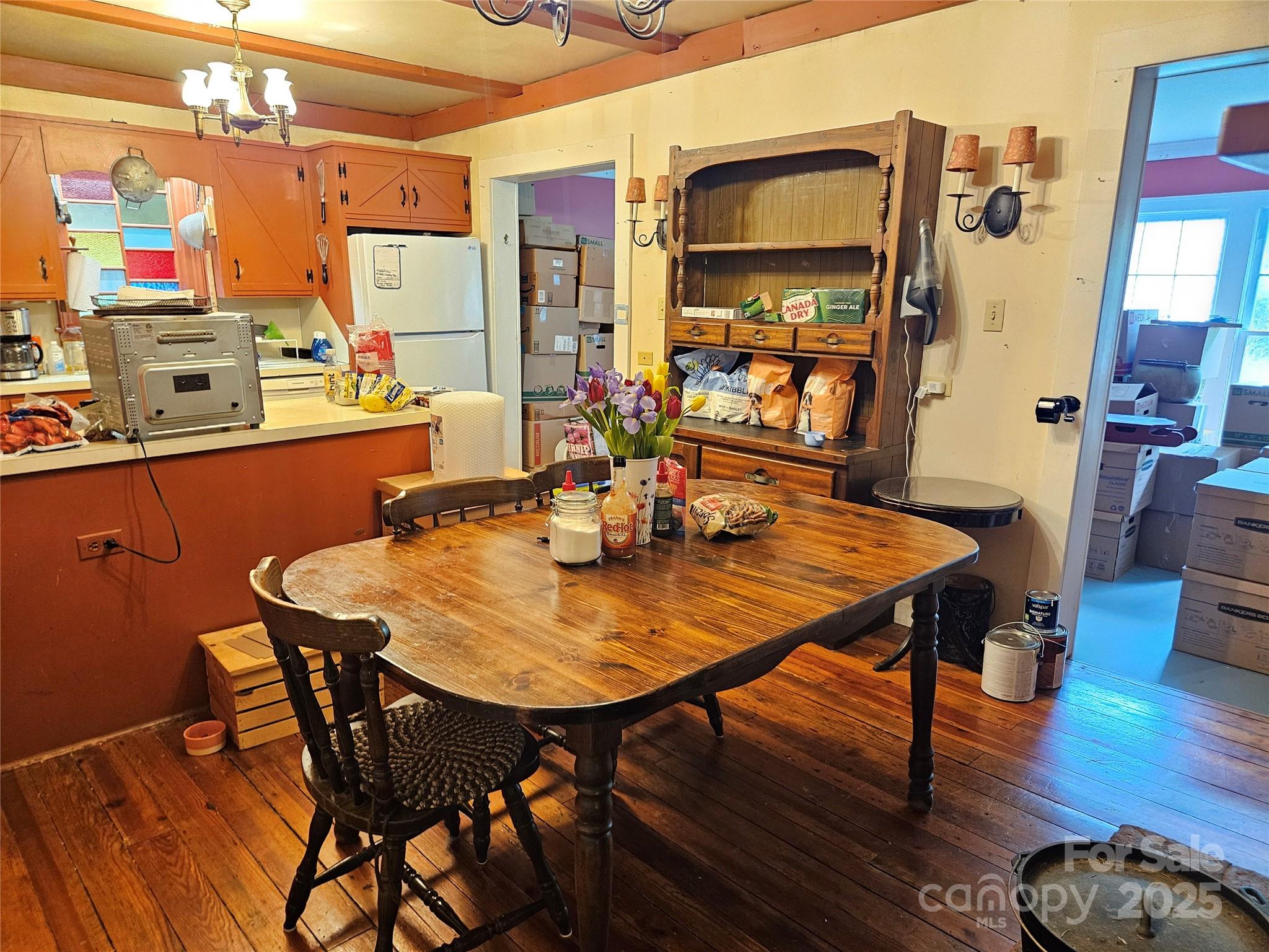 368 Settlemyre Road Morganton, NC 28655 - Photo 19 of 47 a view of a dining room with furniture and wooden floor