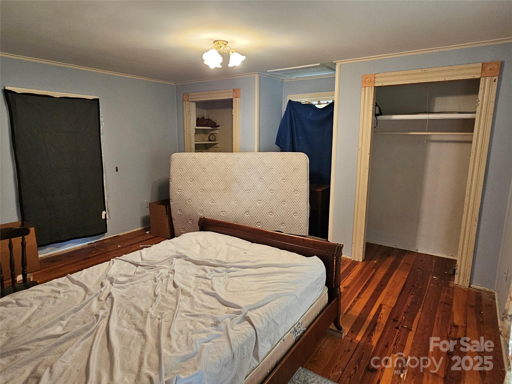 368 Settlemyre Road Morganton, NC 28655 - Photo 30 of 47 a bedroom with a bed and a mirror