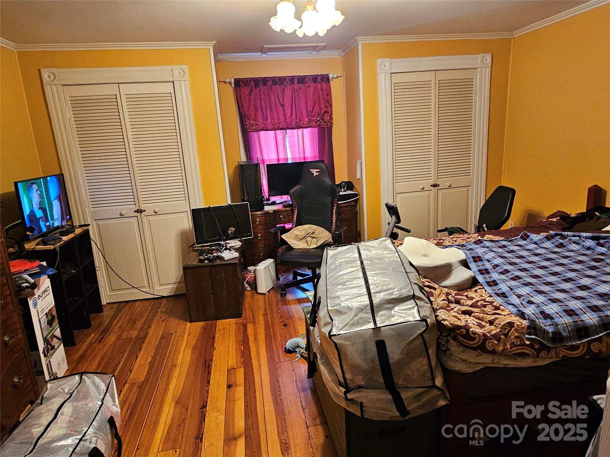 368 Settlemyre Road Morganton, NC 28655 - Photo 31 of 47 a bedroom with a bed and wooden floor