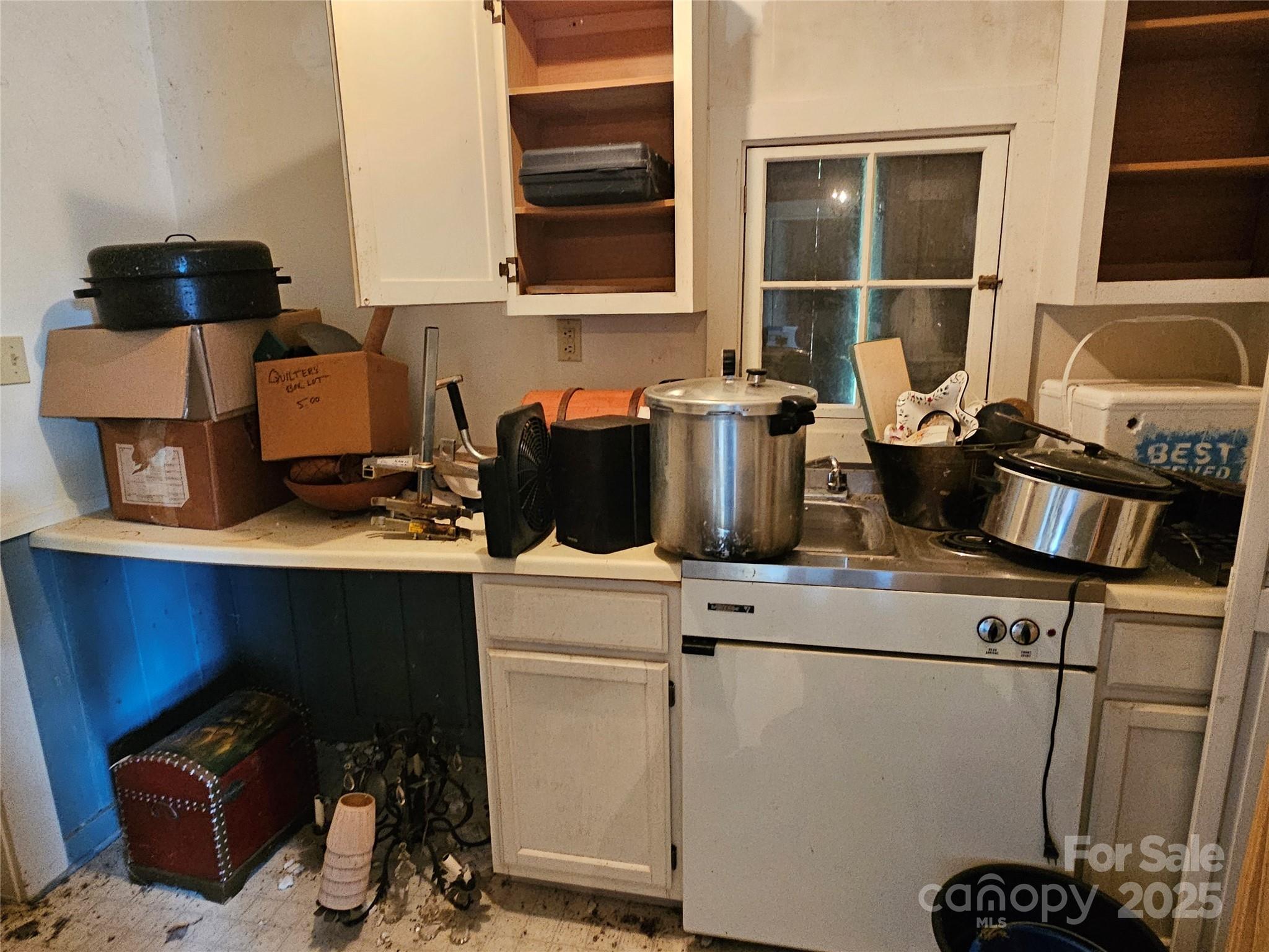 368 Settlemyre Road Morganton, NC 28655 - Photo 36 of 47 a kitchen with a stove and a refrigerator