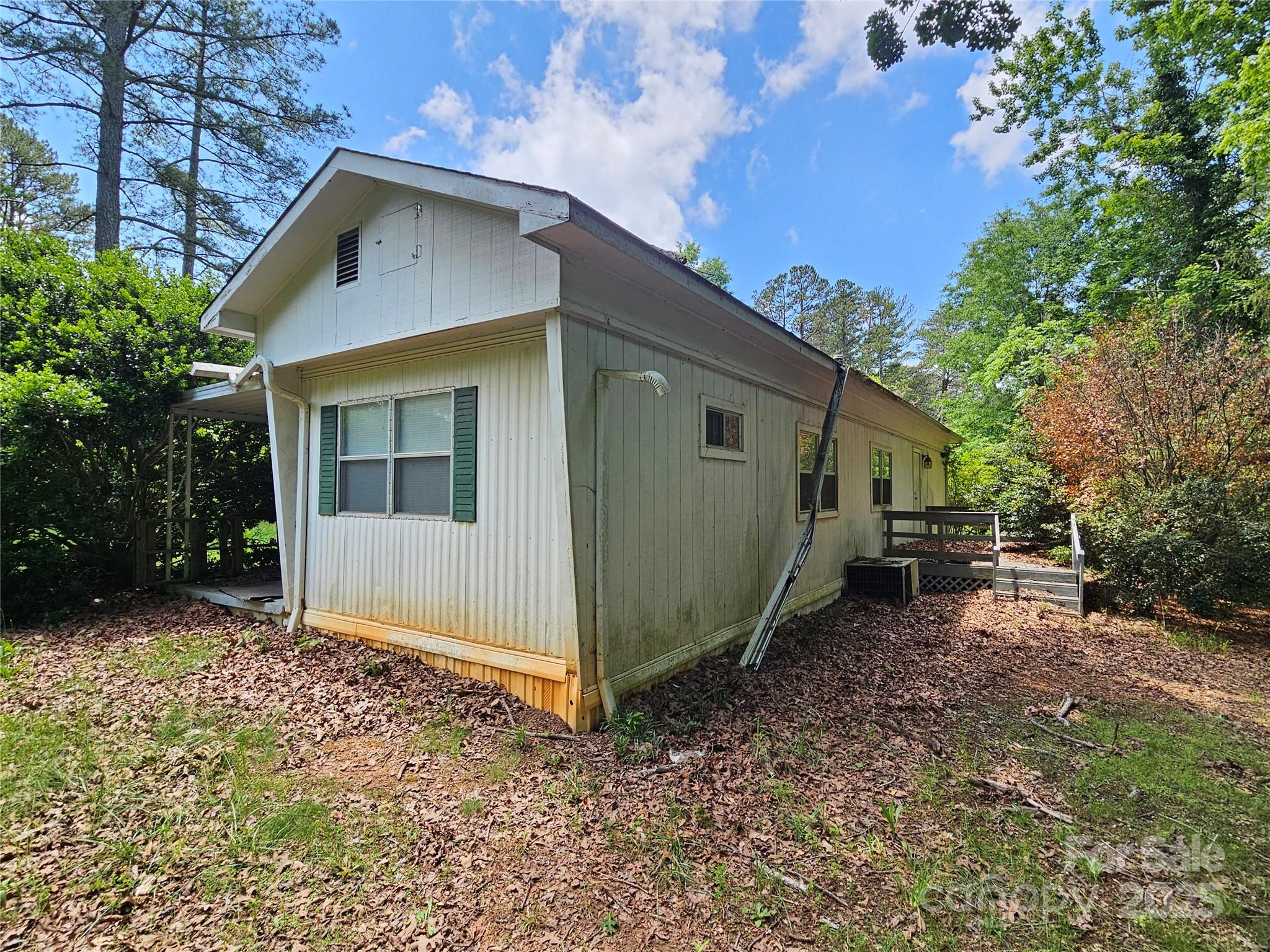 368 Settlemyre Road Morganton, NC 28655 - Photo 42 of 47 a view of a small house with a yard