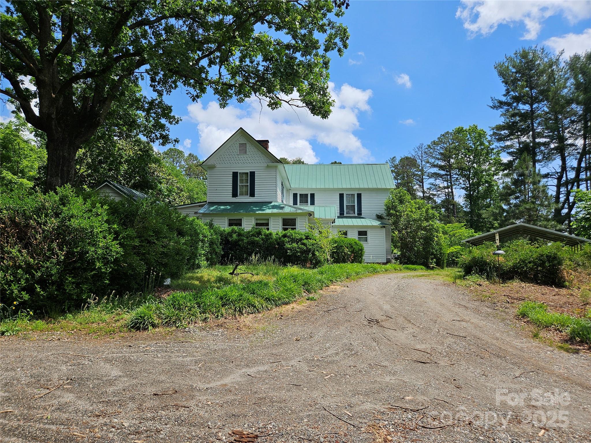 368 Settlemyre Road Morganton, NC 28655 - Photo 44 of 47 a front view of a house with a yard and garage