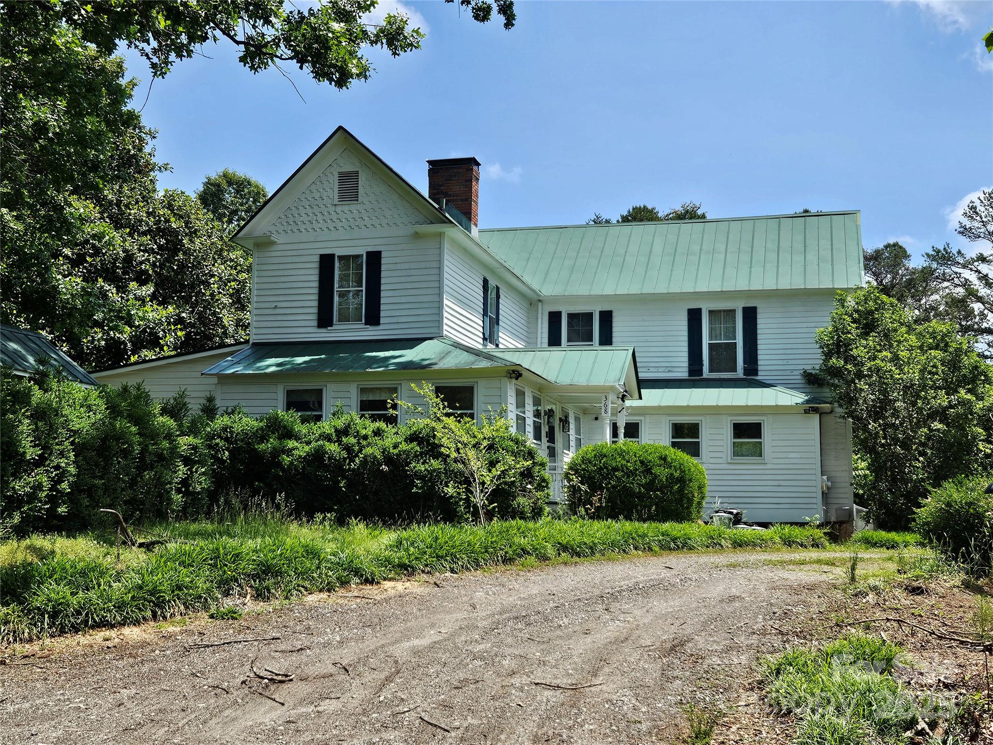 368 Settlemyre Road Morganton, NC 28655 - Photo 46 of 47 a view of a house with garden and plants
