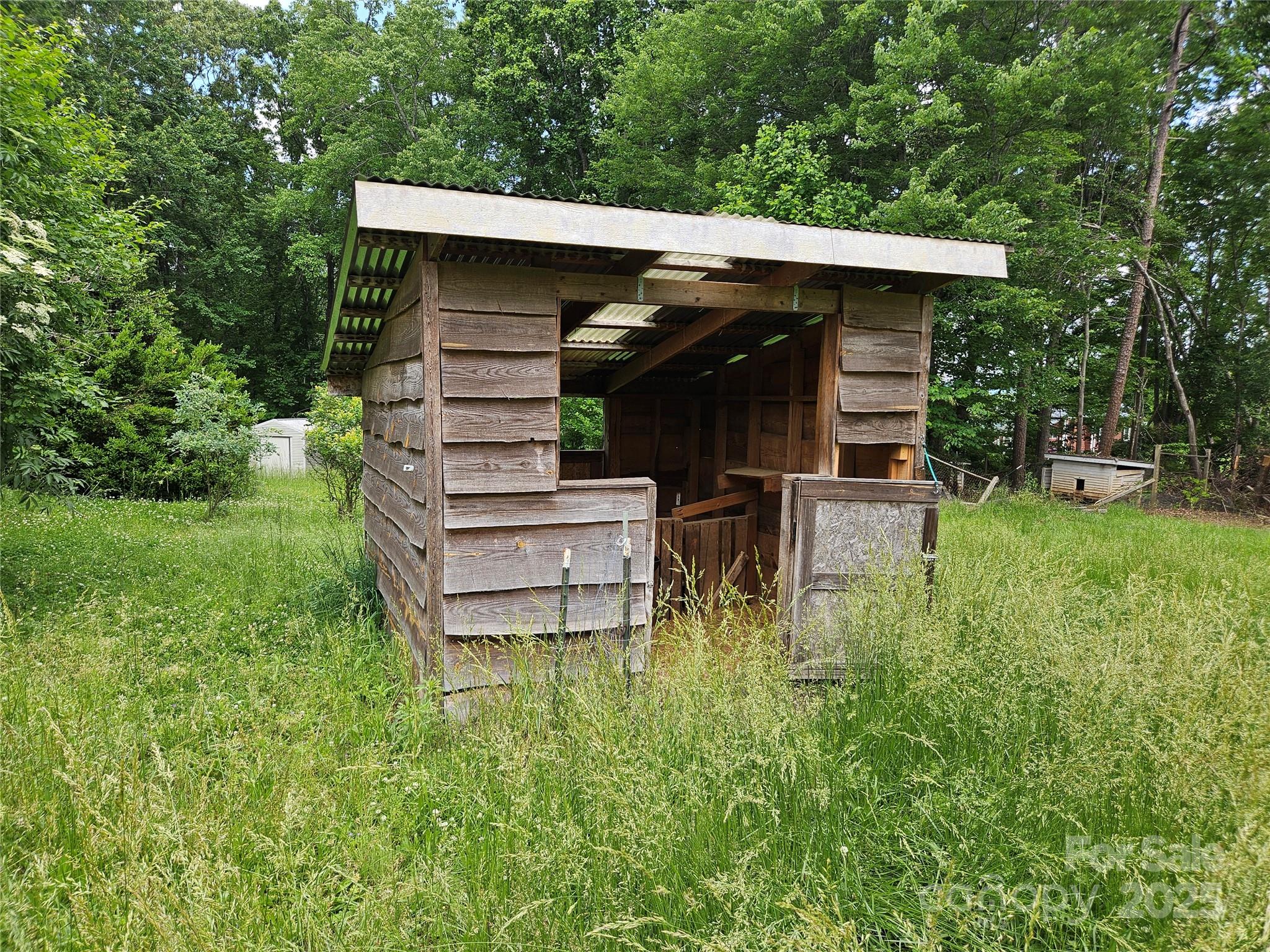 368 Settlemyre Road Morganton, NC 28655 - Photo 9 of 47 a view of a chair and table in backyard of the house