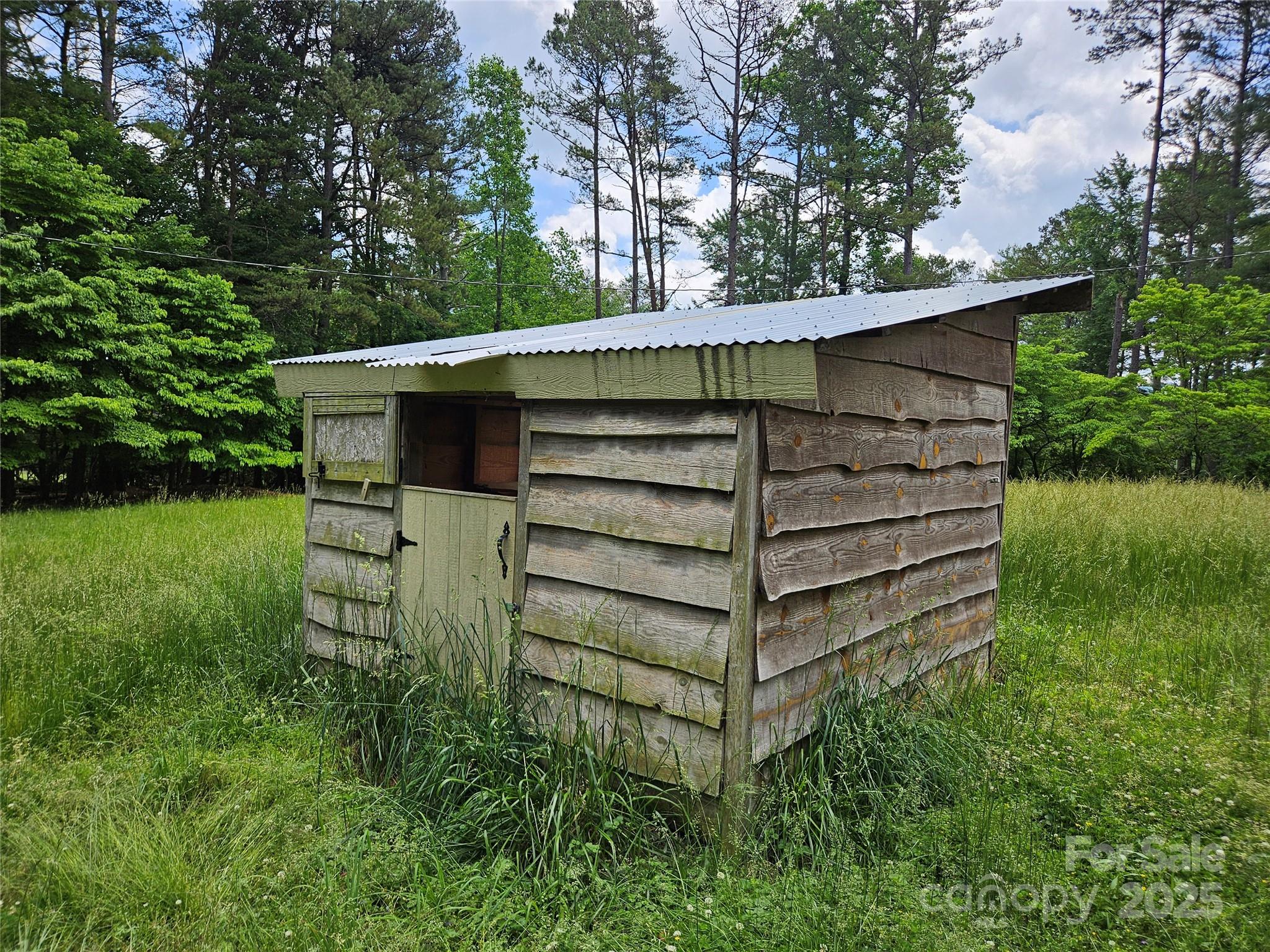 368 Settlemyre Road Morganton, NC 28655 - Photo 10 of 47 a view of a wooden house with a small yard