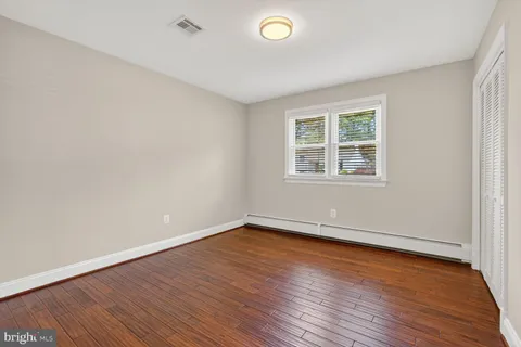 a view of a livingroom with an empty space and stairs