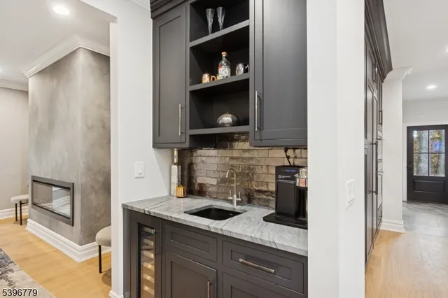 view of a kitchen with a sink and a refrigerator