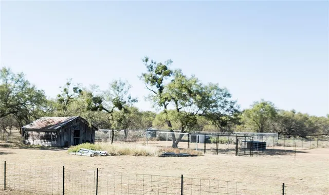 a view of a house with snow on the road
