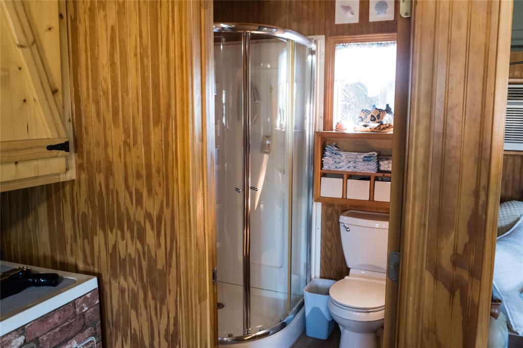 1597 County Road 305 Zephyr, TX 76890 - Photo 4 of 40 a bathroom with a toilet and a shower