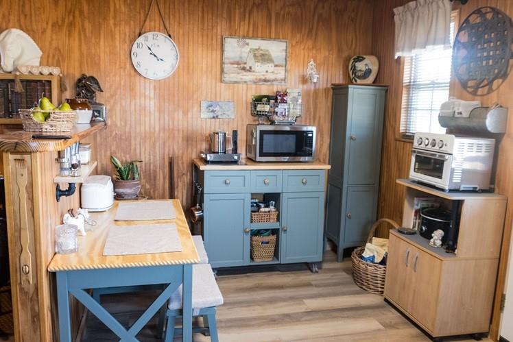 1597 County Road 305 Zephyr, TX 76890 - Photo 9 of 40 a living room with furniture a fireplace and a flat screen tv