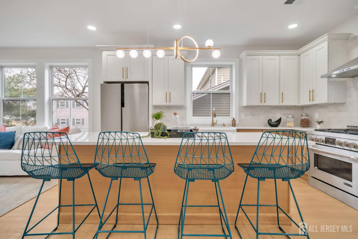 66 Garden Terrace Edison, NJ 08817 - Photo 11 of 40 a view of a dining room with furniture and wooden floor