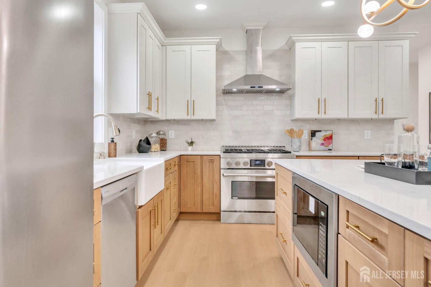 66 Garden Terrace Edison, NJ 08817 - Photo 13 of 40 a kitchen with stainless steel appliances granite countertop a sink stove and refrigerator