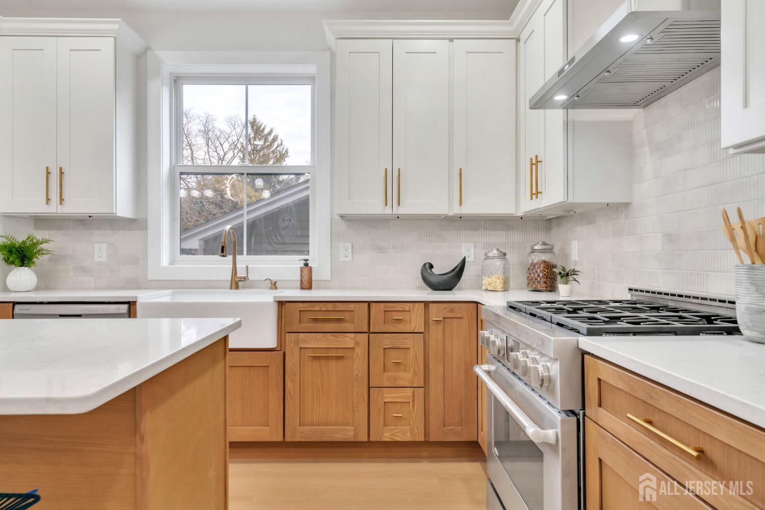 66 Garden Terrace Edison, NJ 08817 - Photo 14 of 40 a kitchen with granite countertop white cabinets and a stove