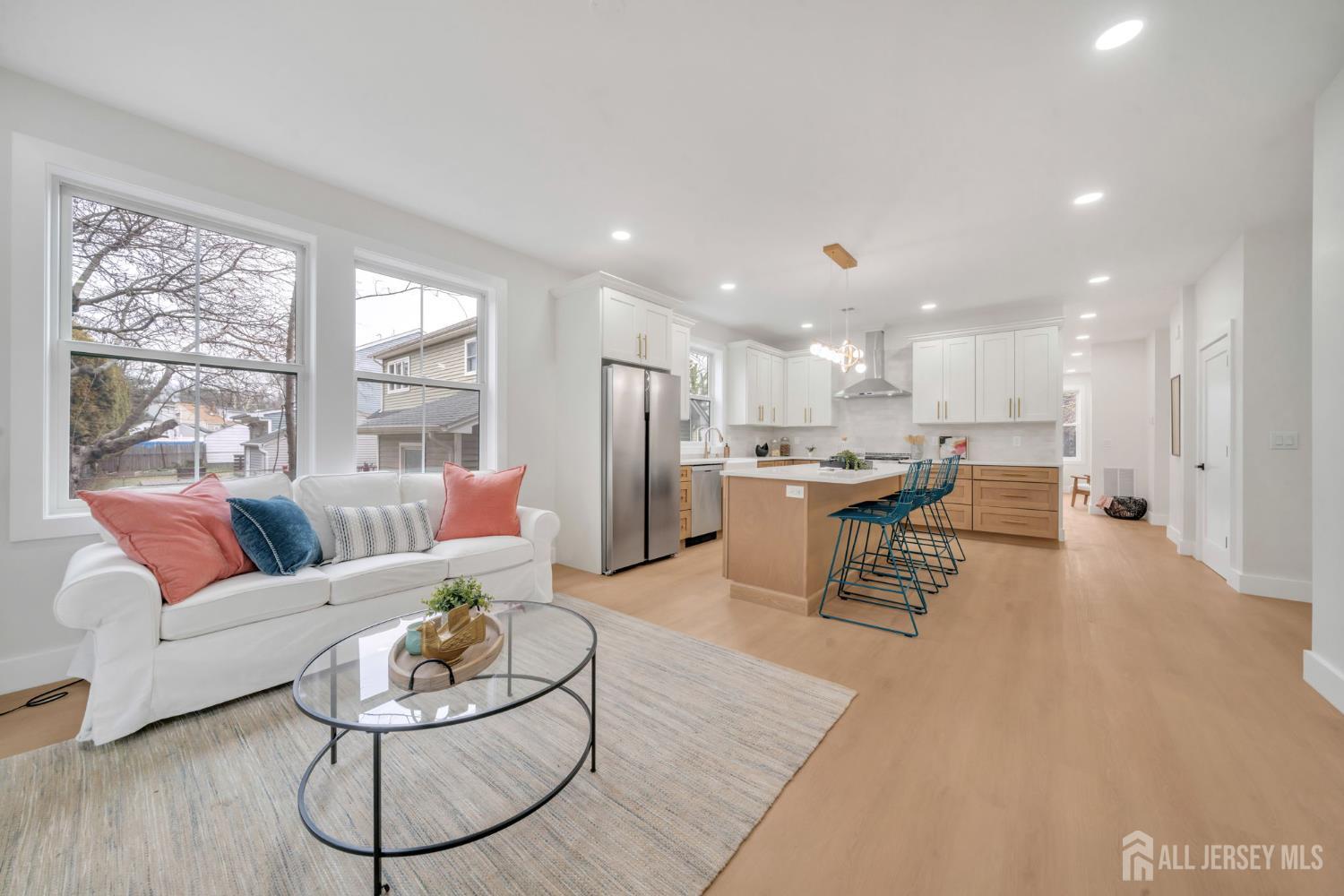66 Garden Terrace Edison, NJ 08817 - Photo 15 of 40 a living room with furniture and kitchen view