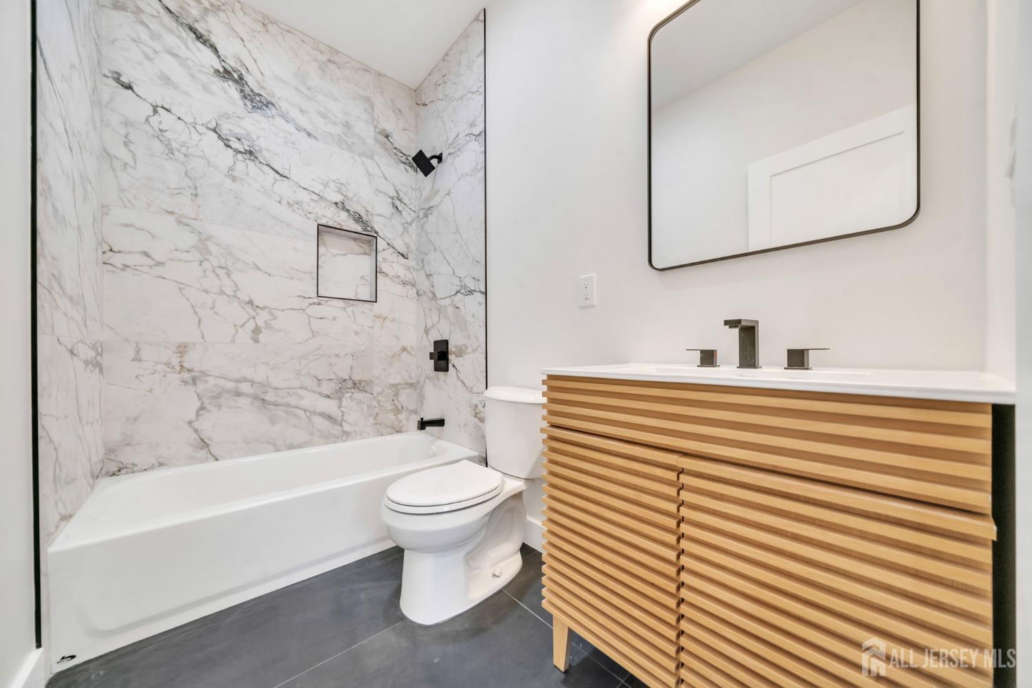 66 Garden Terrace Edison, NJ 08817 - Photo 18 of 40 a bathroom with a sink a toilet and a bathtub