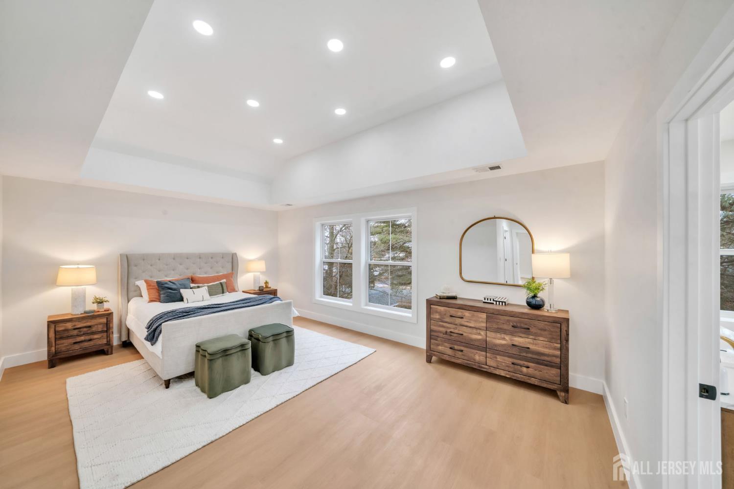 66 Garden Terrace Edison, NJ 08817 - Photo 22 of 40 a spacious bedroom with a bed and a dresser