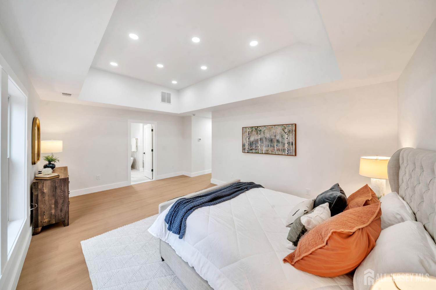 66 Garden Terrace Edison, NJ 08817 - Photo 25 of 40 a bedroom with a large bed and a couch