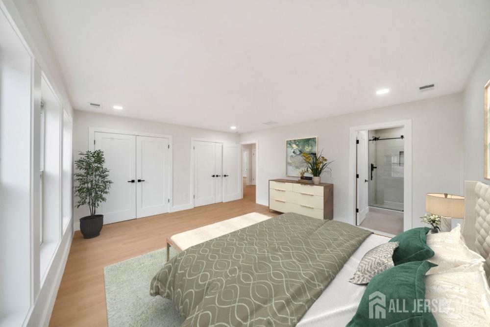 66 Garden Terrace Edison, NJ 08817 - Photo 28 of 40 a spacious bedroom with a bed and a couch