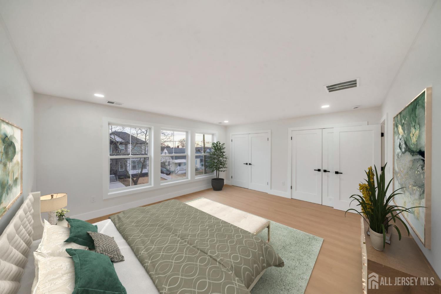 66 Garden Terrace Edison, NJ 08817 - Photo 29 of 40 a large bedroom with a bed and a large window