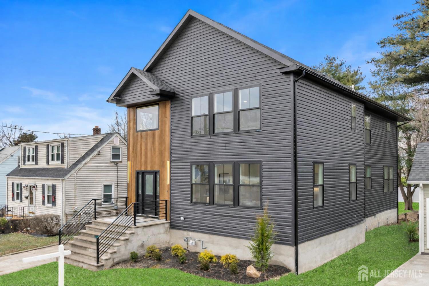 66 Garden Terrace Edison, NJ 08817 - Photo 3 of 40 a front view of a house with garden