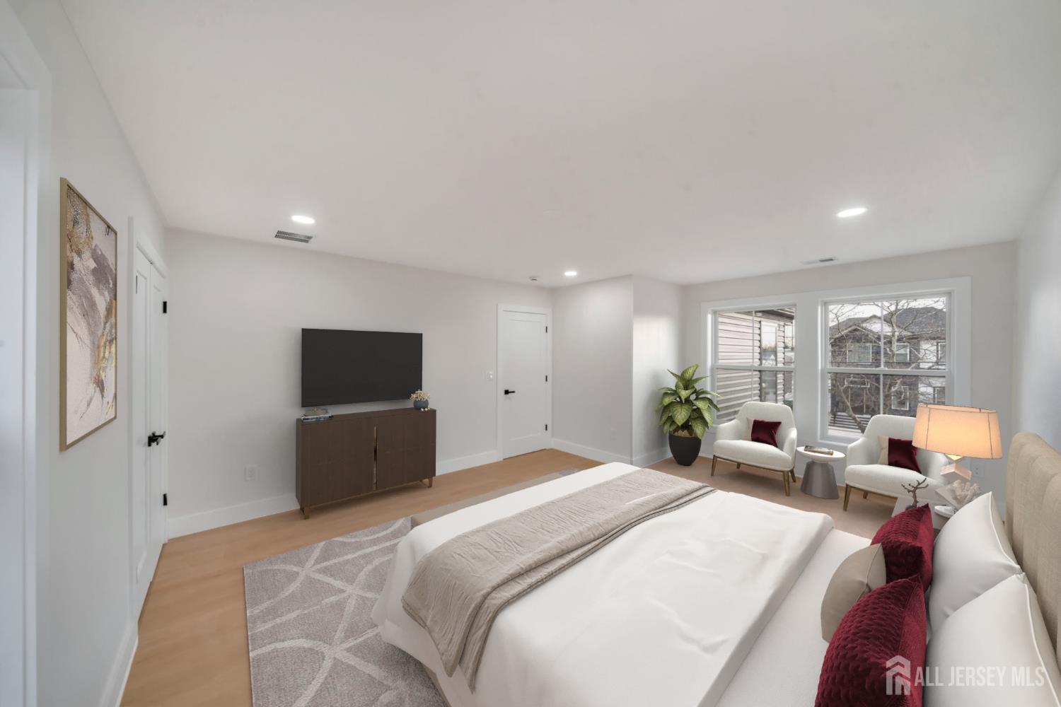 66 Garden Terrace Edison, NJ 08817 - Photo 31 of 40 a bedroom with a bed and large windows