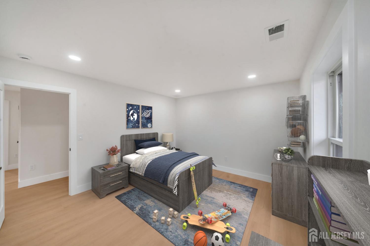 66 Garden Terrace Edison, NJ 08817 - Photo 34 of 40 a bedroom with a bed and wooden floor