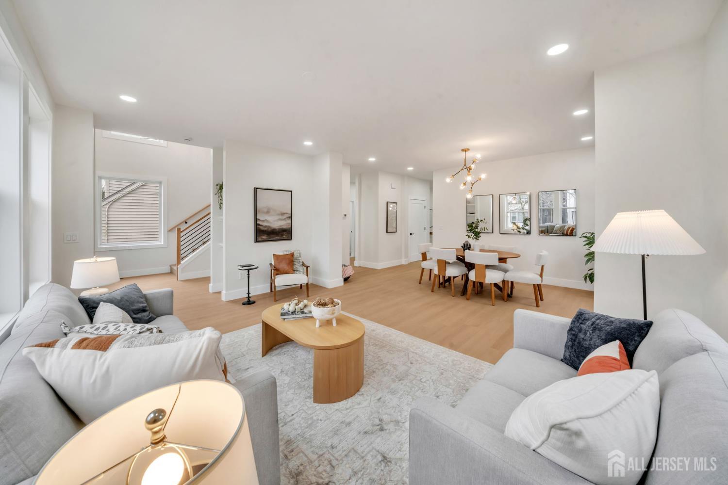 66 Garden Terrace Edison, NJ 08817 - Photo 7 of 40 a living room with furniture and a table