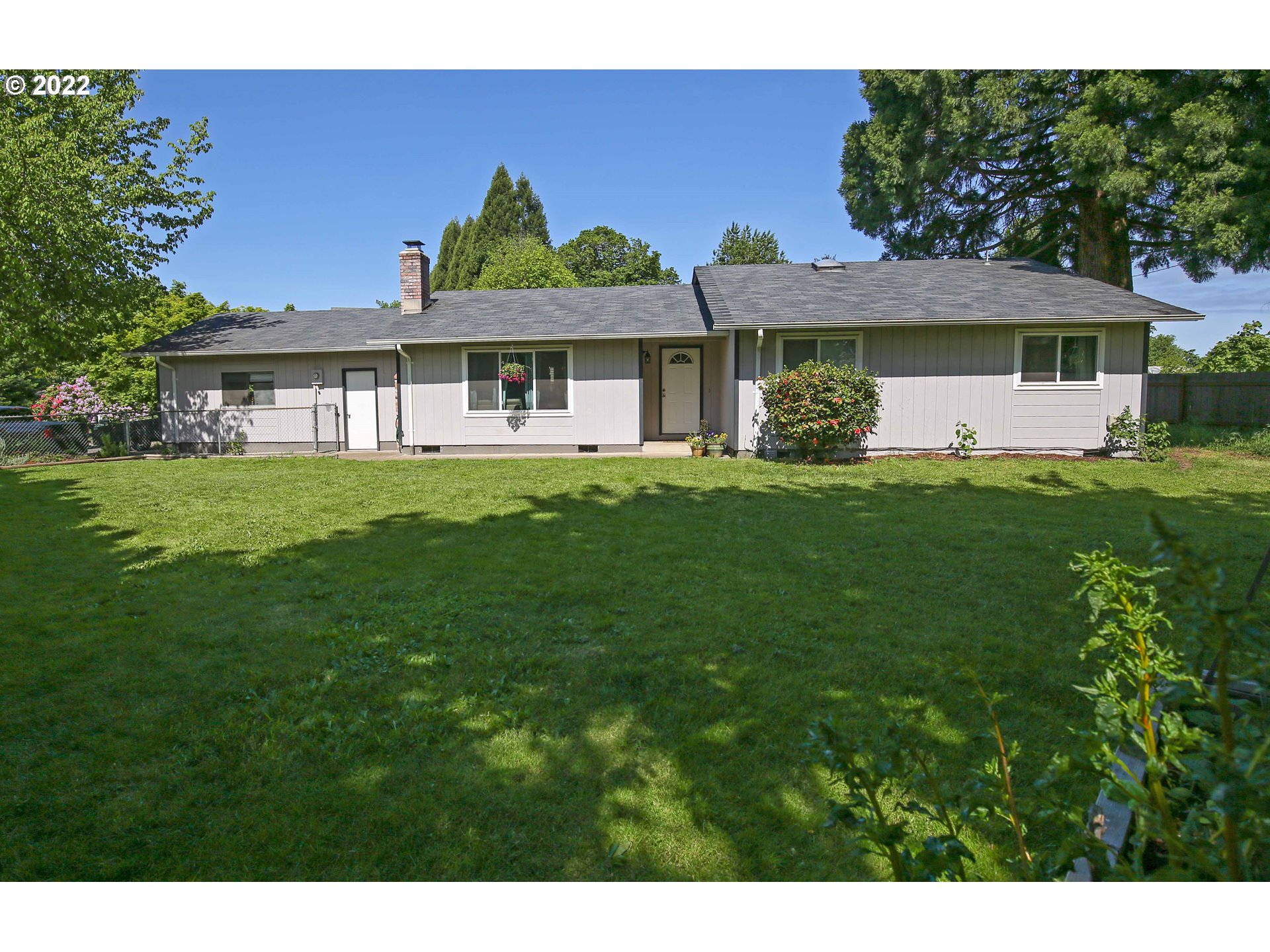 1071 Cole Way Springfield, OR 97478 - Photo 1 of 30 a front view of a house with a garden
