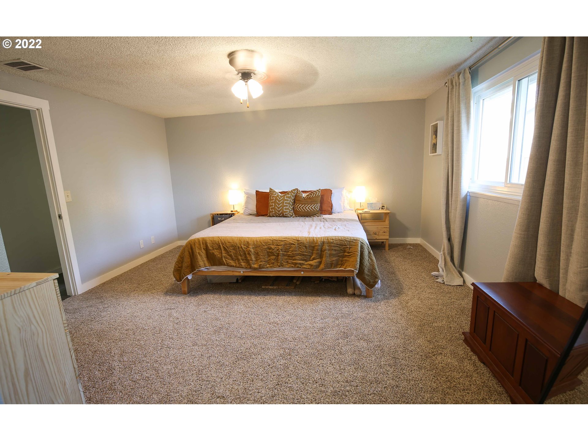 1071 Cole Way Springfield, OR 97478 - Photo 11 of 30 a bedroom with a bed and a flat screen tv