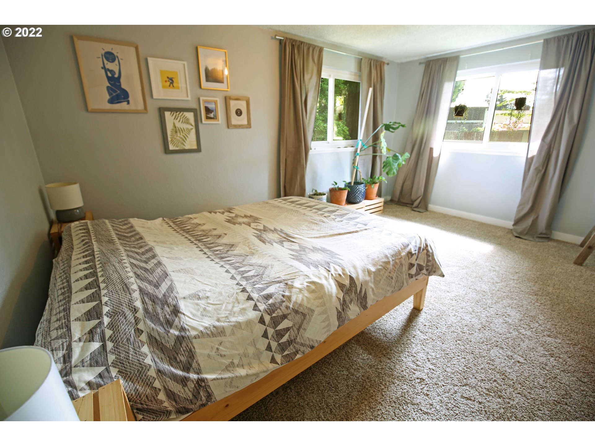 1071 Cole Way Springfield, OR 97478 - Photo 16 of 30 a bed sitting in a bedroom next to a window