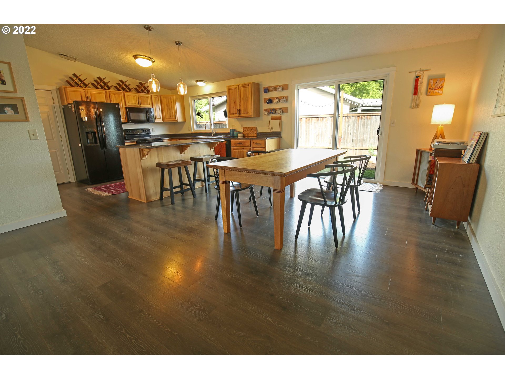 1071 Cole Way Springfield, OR 97478 - Photo 6 of 30 a view of a dining room with furniture window and wooden floor
