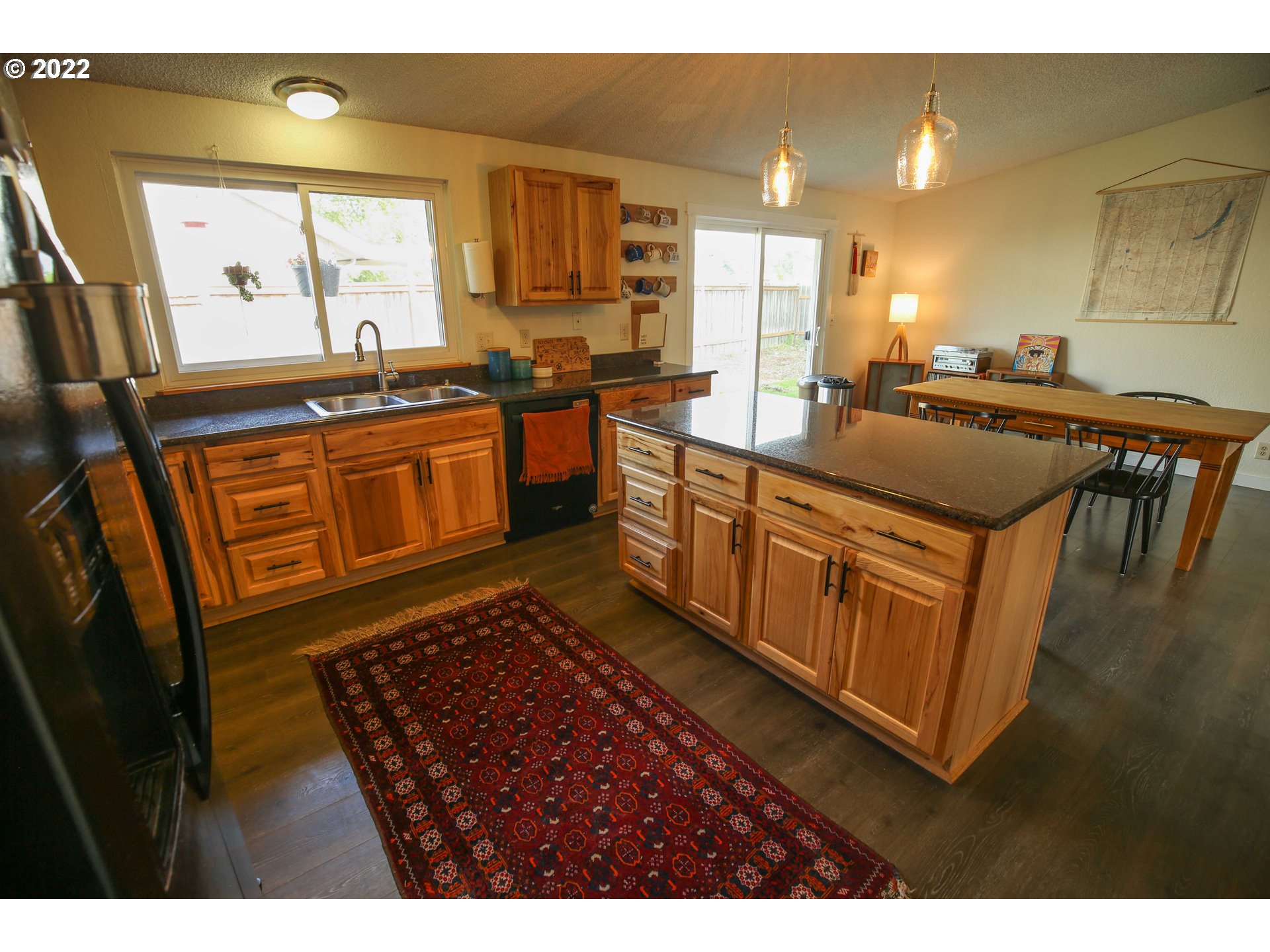 1071 Cole Way Springfield, OR 97478 - Photo 9 of 30 a kitchen with stainless steel appliances granite countertop a sink stove and cabinets