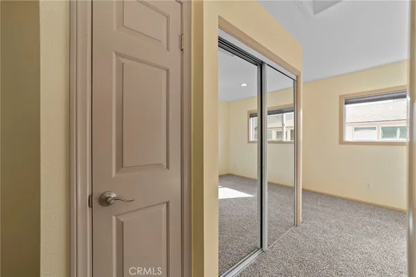 a view of a big room with closet and wooden floor