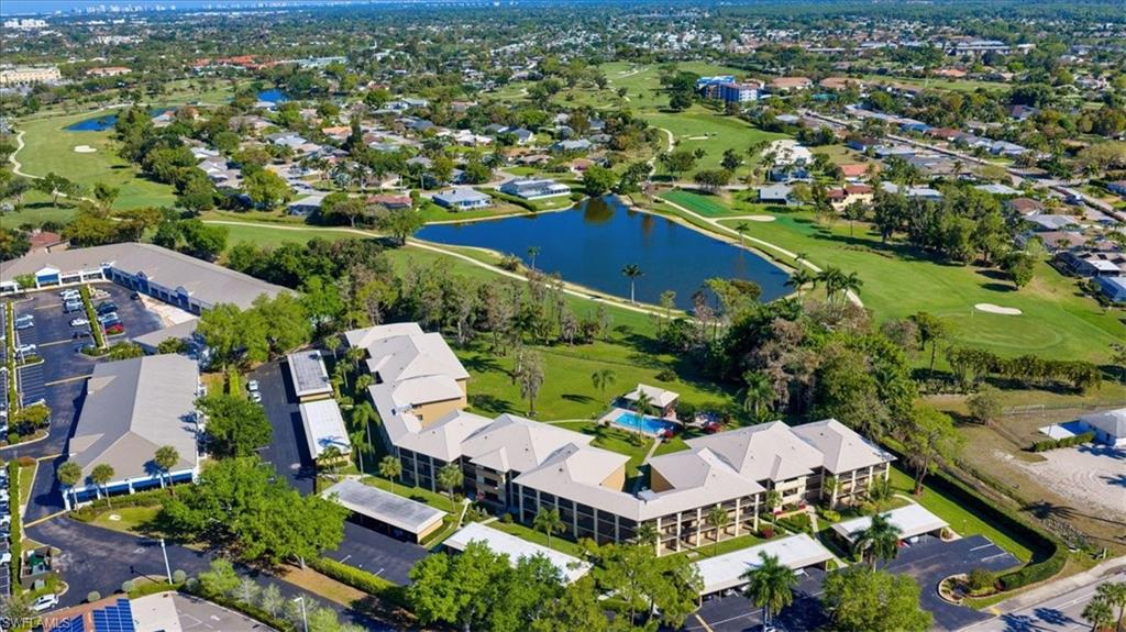 an aerial view of a house with a swimming pool yard and outdoor seating