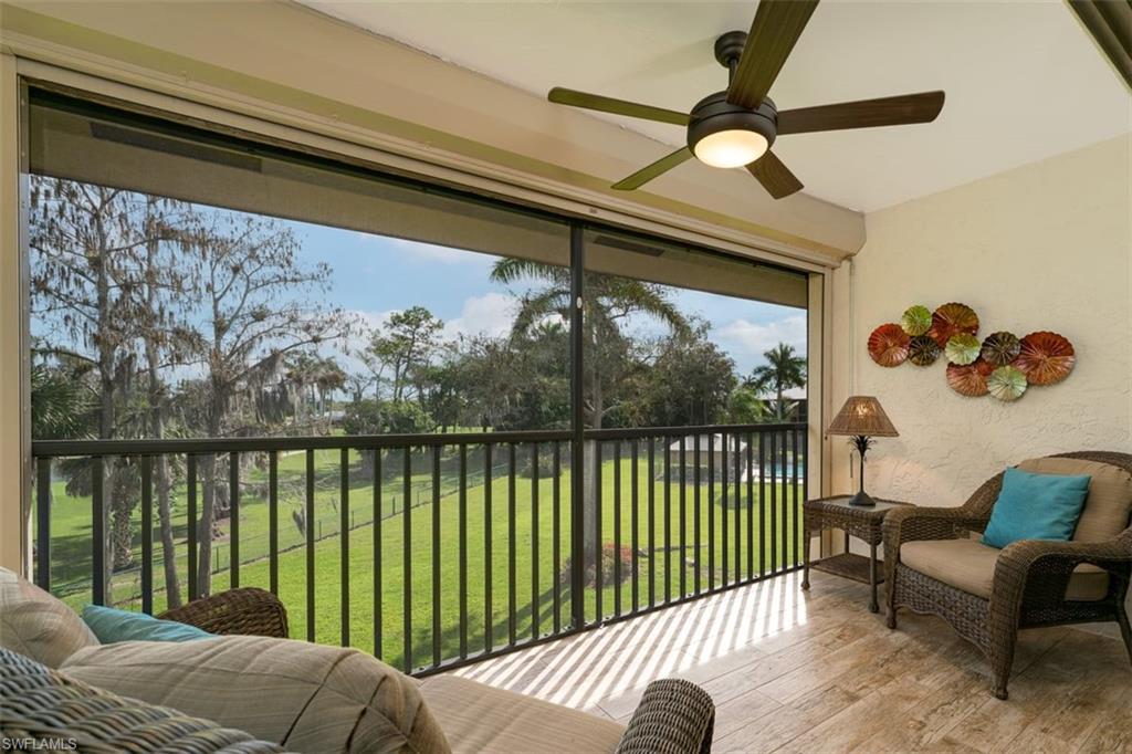 75 St Andrews Boulevard, Unit C301 Naples, FL 34113 - Photo 14 of 42 a view of a porch with furniture