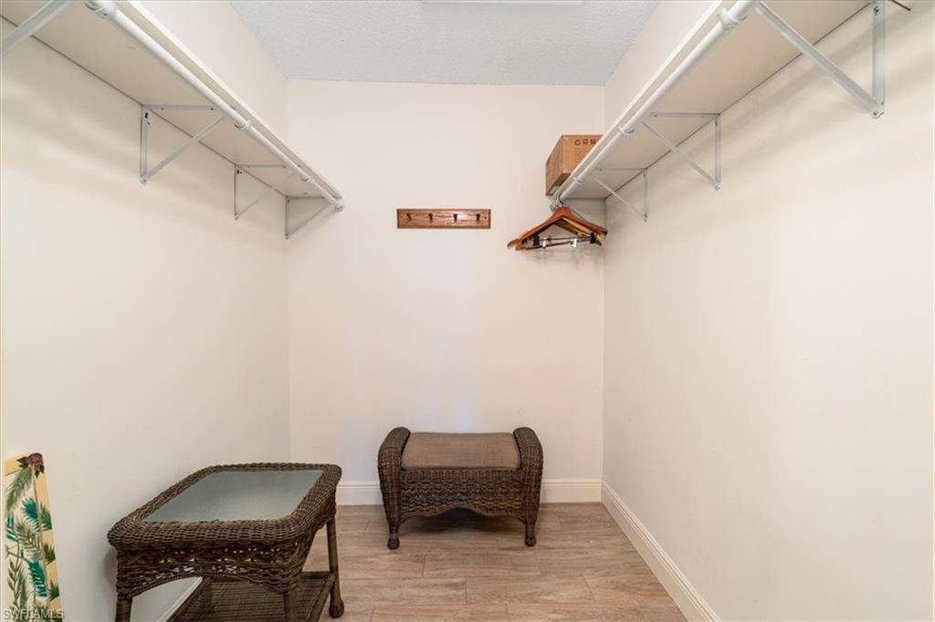 75 St Andrews Boulevard, Unit C301 Naples, FL 34113 - Photo 19 of 42 a view of a room with table and chair