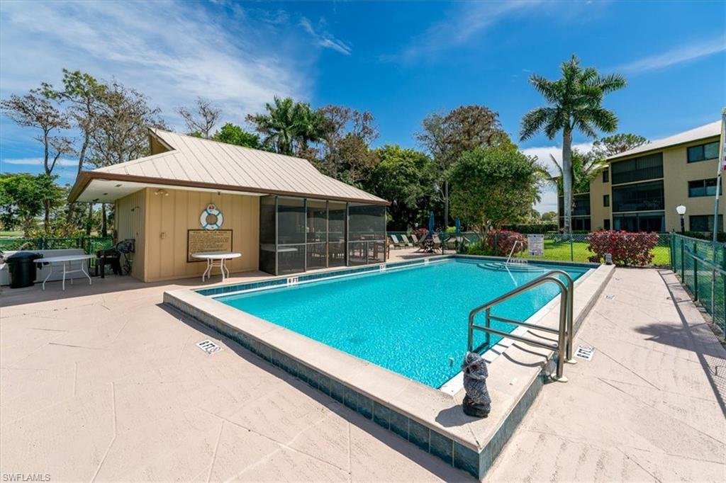 75 St Andrews Boulevard, Unit C301 Naples, FL 34113 - Photo 30 of 42 a view of a backyard with a patio