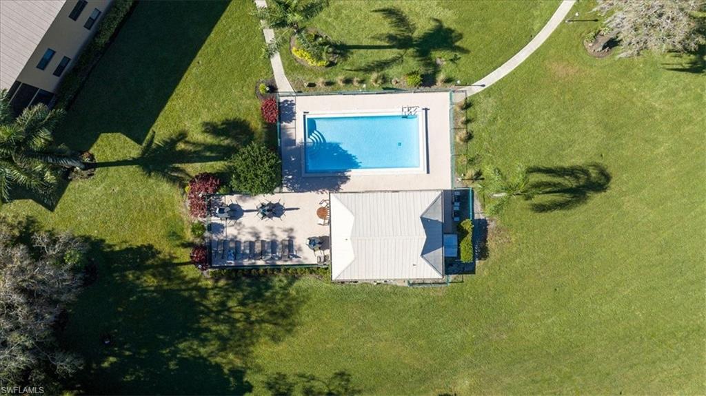 75 St Andrews Boulevard, Unit C301 Naples, FL 34113 - Photo 33 of 42 a small garden in the corner of a house