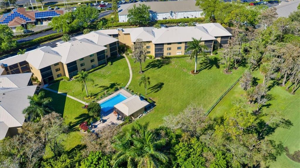 75 St Andrews Boulevard, Unit C301 Naples, FL 34113 - Photo 34 of 42 an aerial view of a house with yard swimming pool and outdoor seating