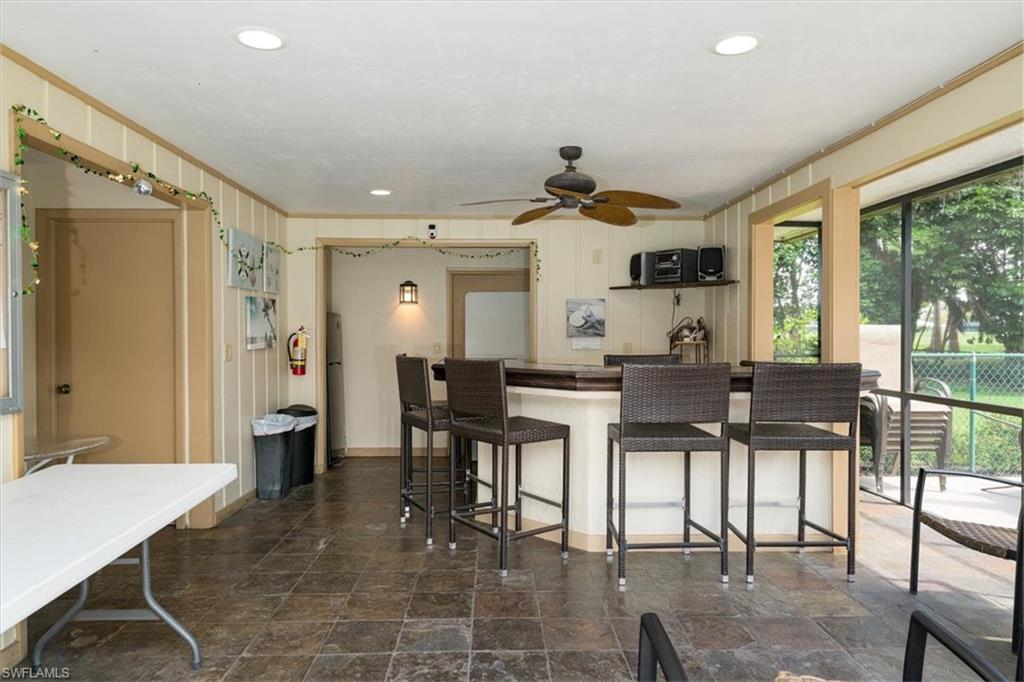 75 St Andrews Boulevard, Unit C301 Naples, FL 34113 - Photo 36 of 42 a view of a dining room with furniture