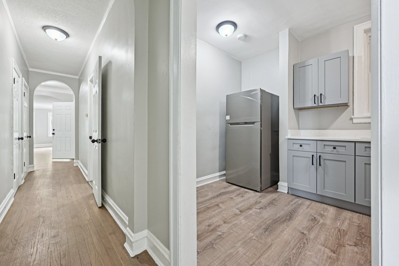 2506 East 78th Street, Unit 2 Chicago, IL 60649 - Photo 14 of 24 a view of a kitchen with a sink and refrigerator