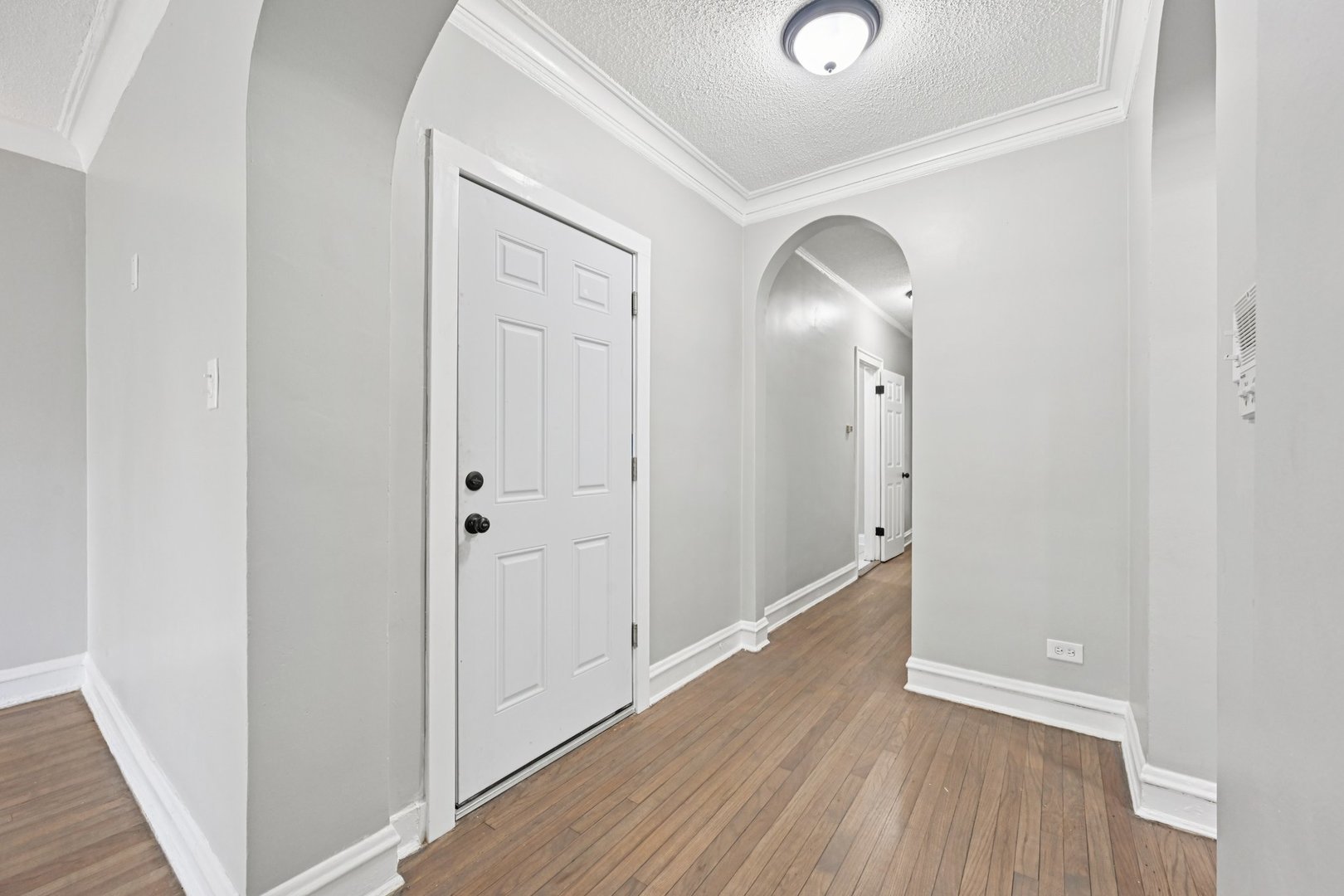 2506 East 78th Street, Unit 2 Chicago, IL 60649 - Photo 16 of 24 a view of a hallway with wooden floor