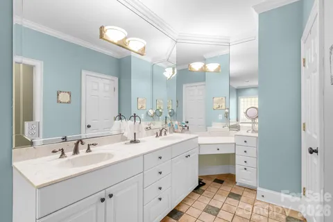 a bathroom with a shower and a mirror