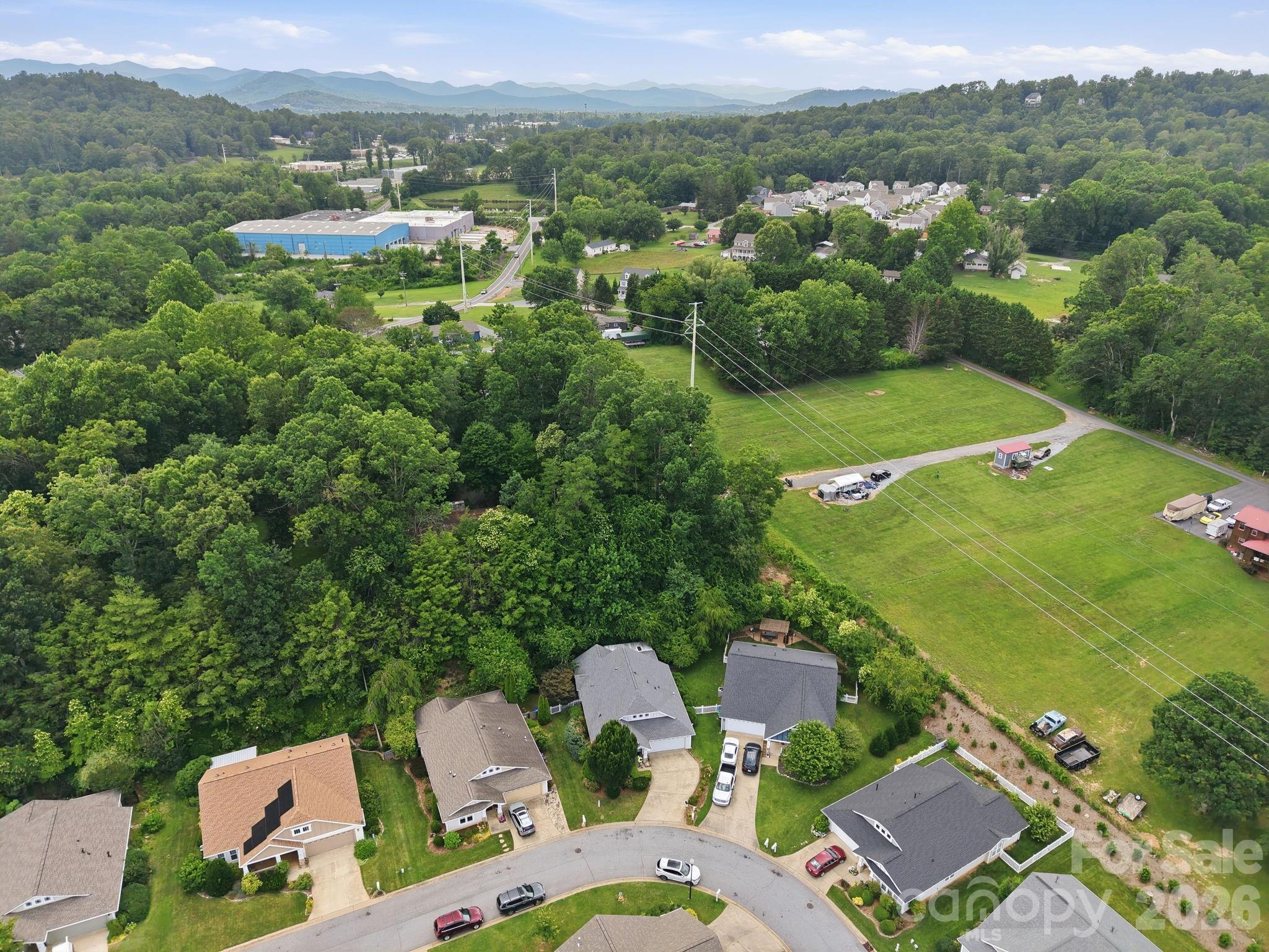 51 Sunview Circle Arden, NC 28704 - Photo 30 of 31 a view of a city with lush green forest