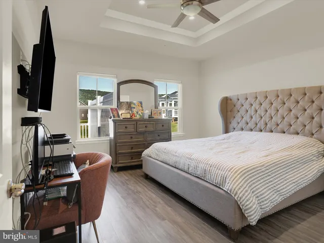a spacious bathroom with a double vanity sink a mirror and a shower