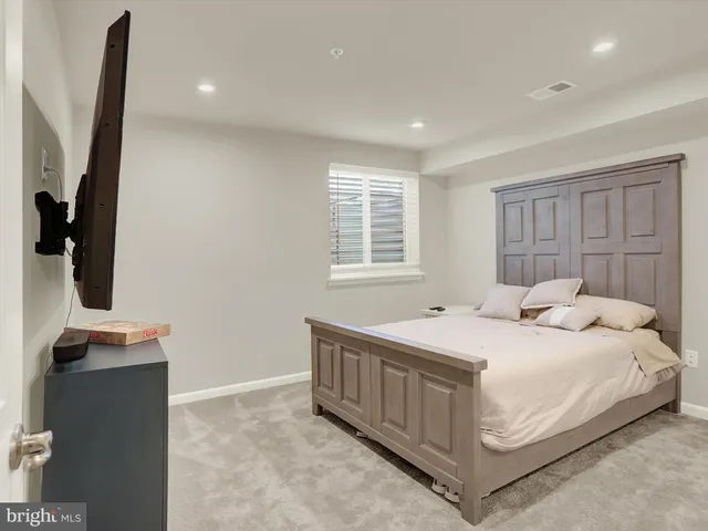 a bathroom with a toilet a sink and shower