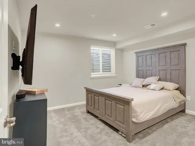 a view of a chair and table on the roof deck