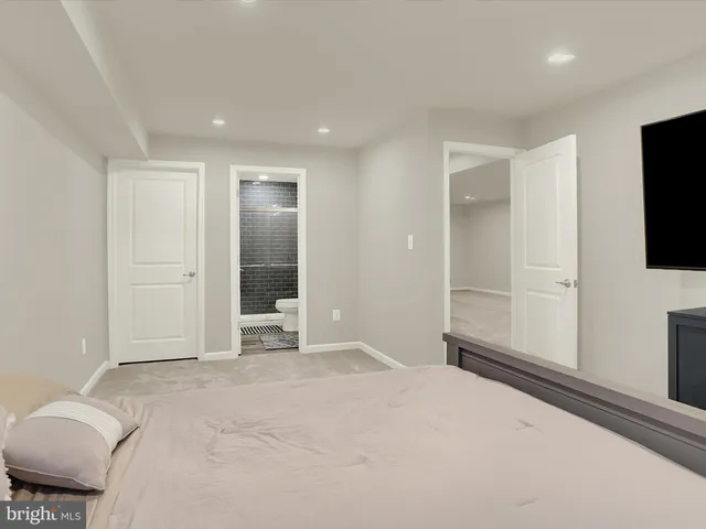 a balcony with wooden floor and furniture