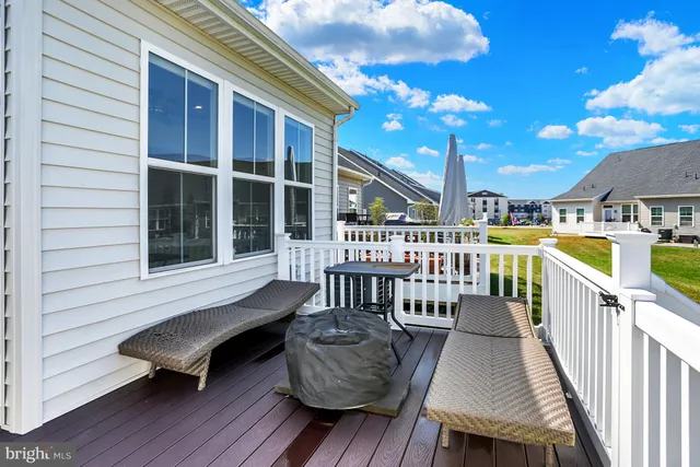 a view of a house with a backyard and porch