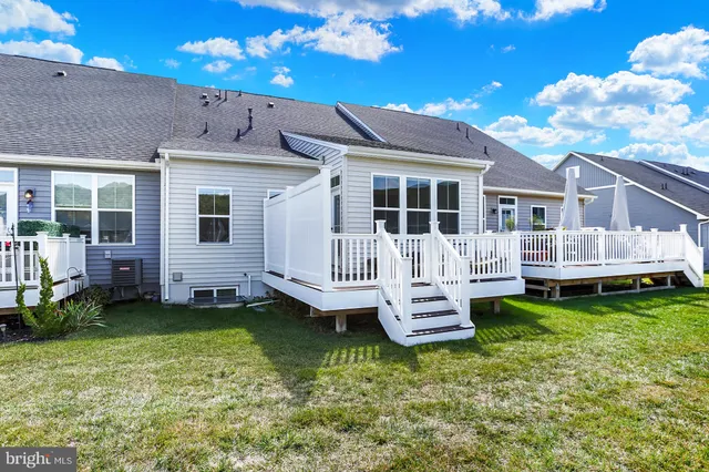 a view of houses with an outdoor space and lakeside